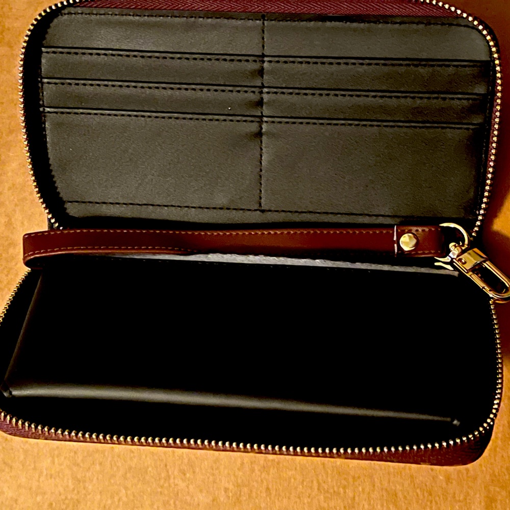A cellphone case. It is for IPhone 13 ProMax. Has six slots in it.